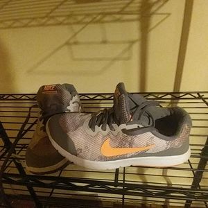 Grey and orange running shoe NIKE